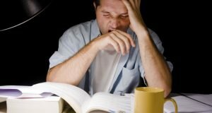 Young Man Studying at Night